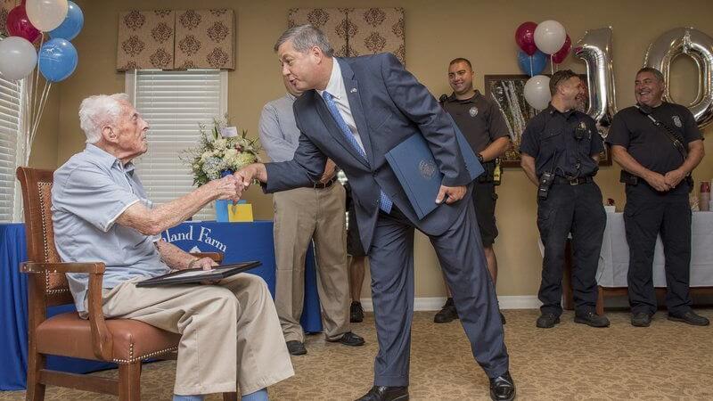 Man and senior man shaking hands