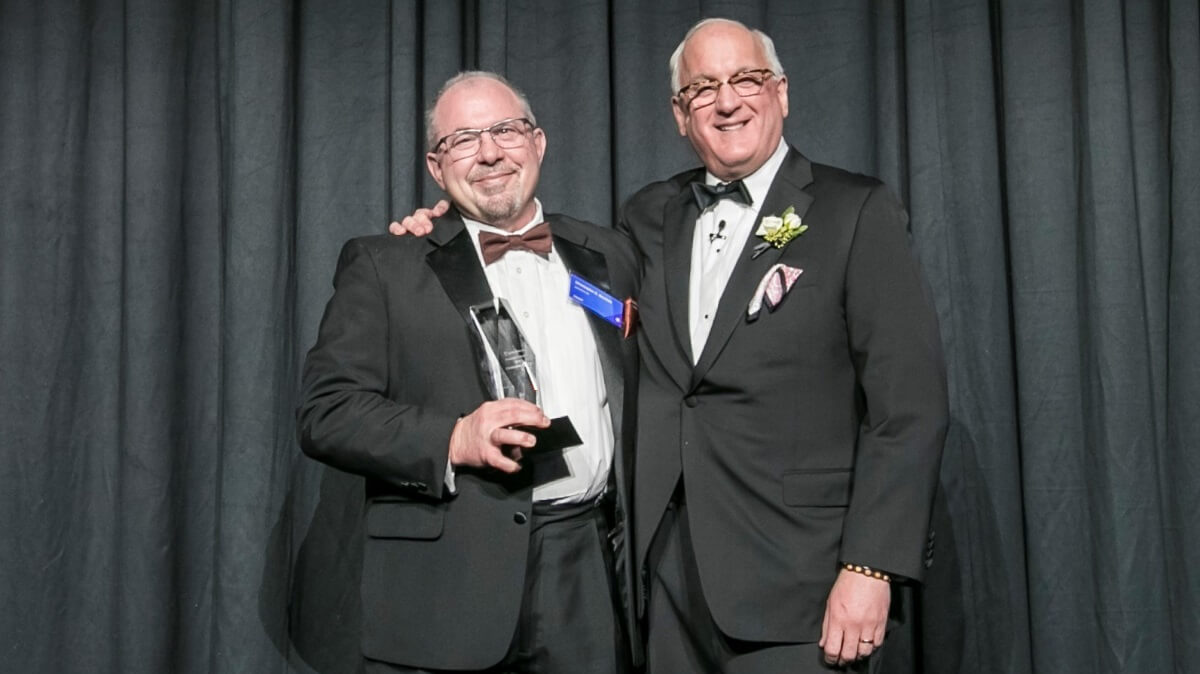 Man receiving award at gala