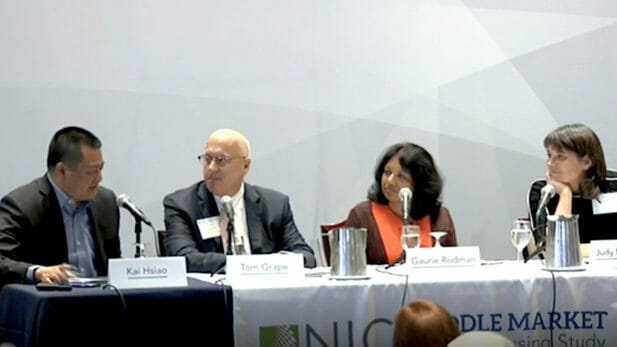 Panel speaking at event