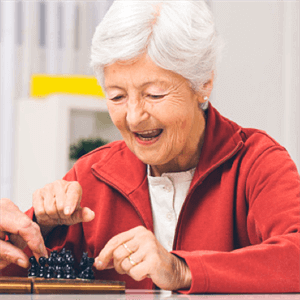 Senior woman playing chess