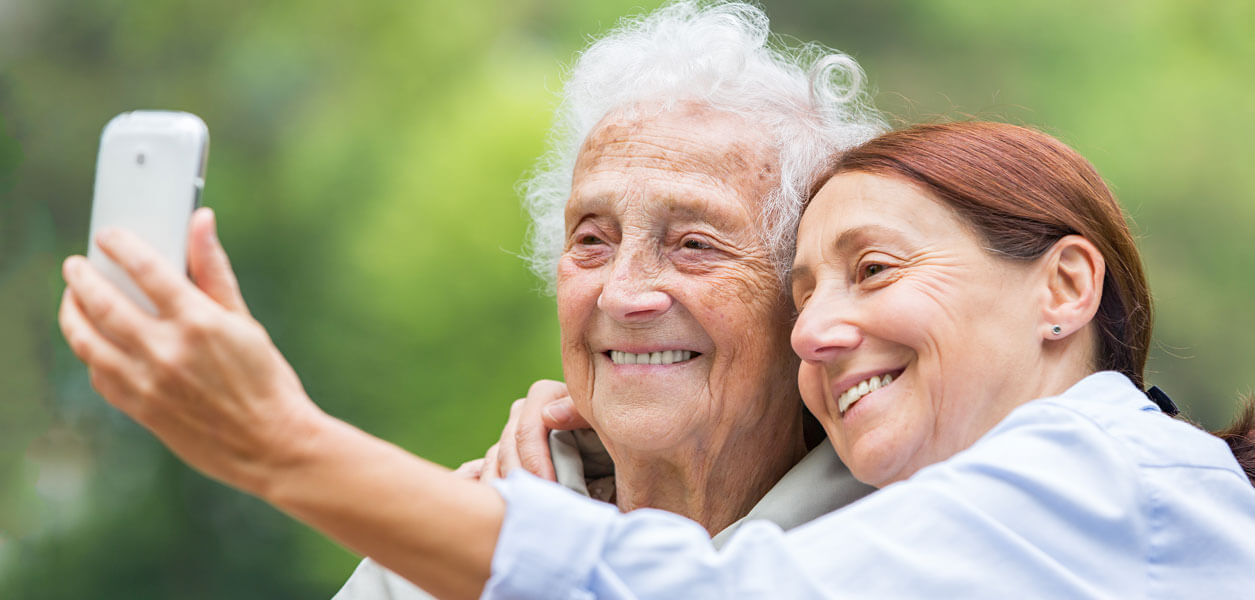 Woman and senior woman taking selfie