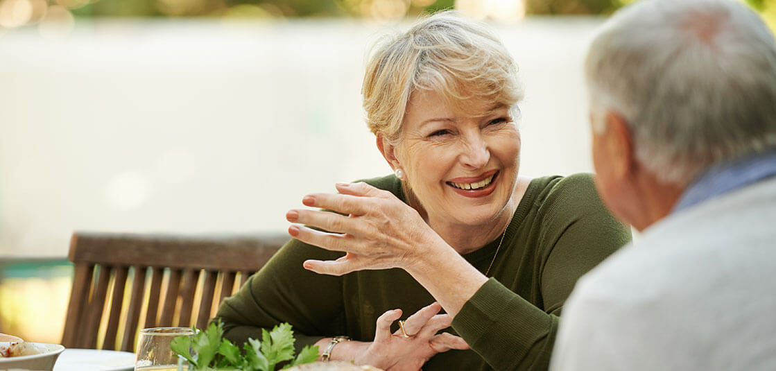 Adults eating outdoors