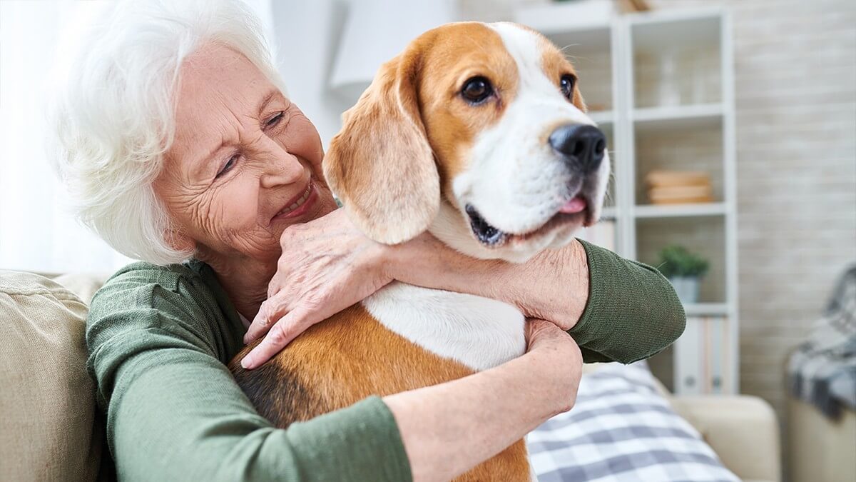 Woman holding dog