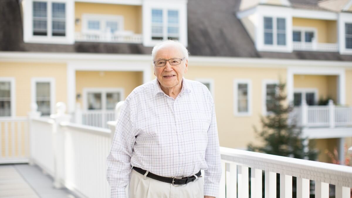 Senior man posing for photo outdoors