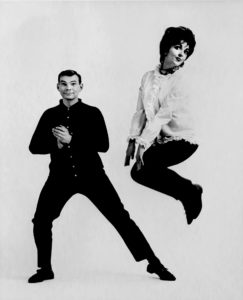 Black and white photo of man and woman ballroom dancing