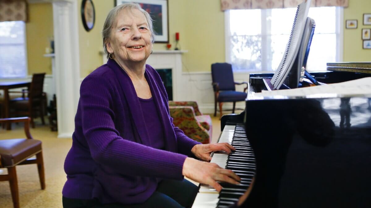 Older woman playing piano