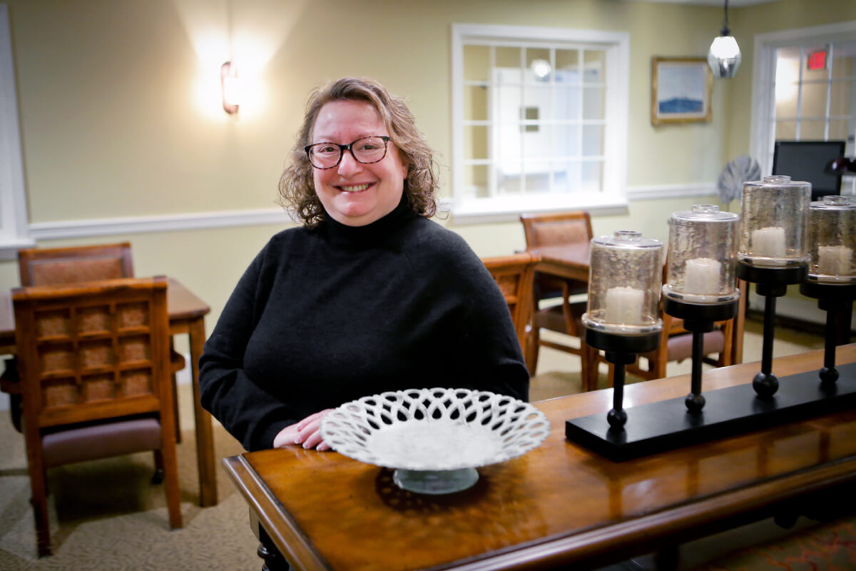 Woman posing for photo in kitchen room