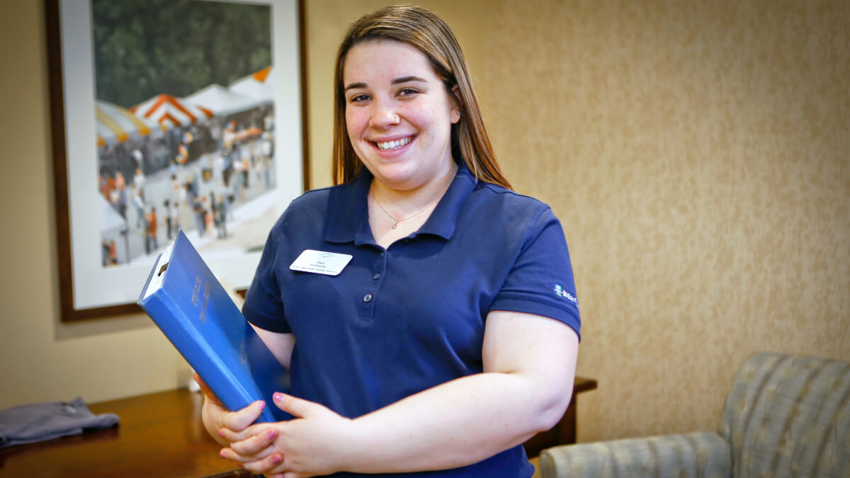 Woman holding textbooks