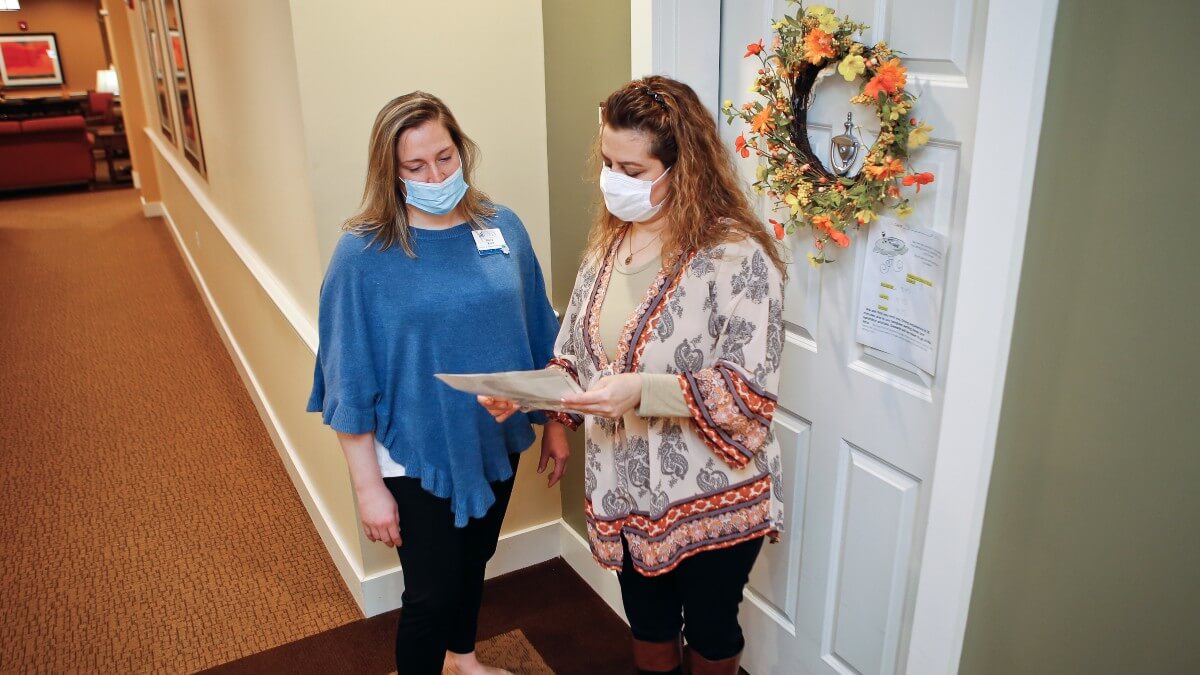 Two female nurses wearing PPE masks