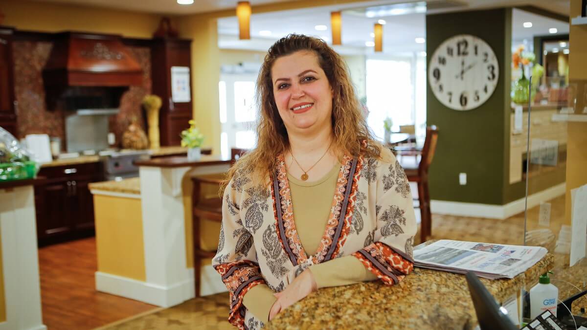 Woman in senior living facility bistro