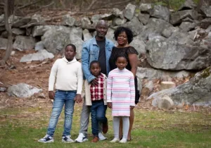 Family posing for photo outdoors