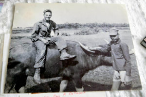 Black and white photo of US armed forces soldier and Vietnamese man