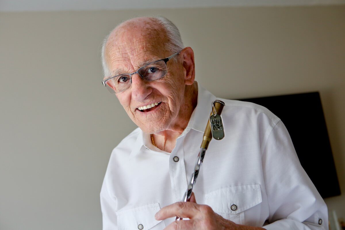 Senior man holding crafts