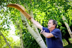 Man holding Jai Alai wicker