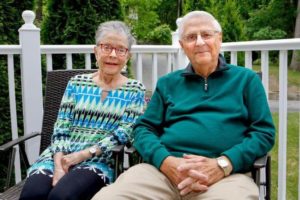 Senior couple sitting outdoors