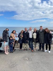 Family posing for photo at beach