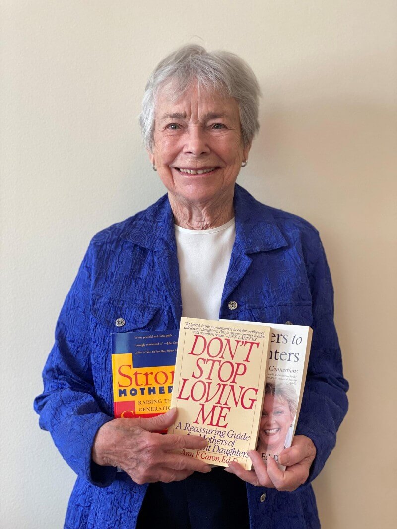 Older woman holding books