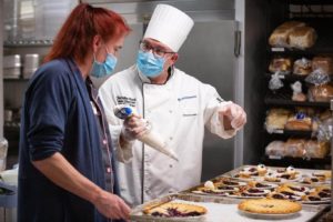 Culinary staff preparing desserts