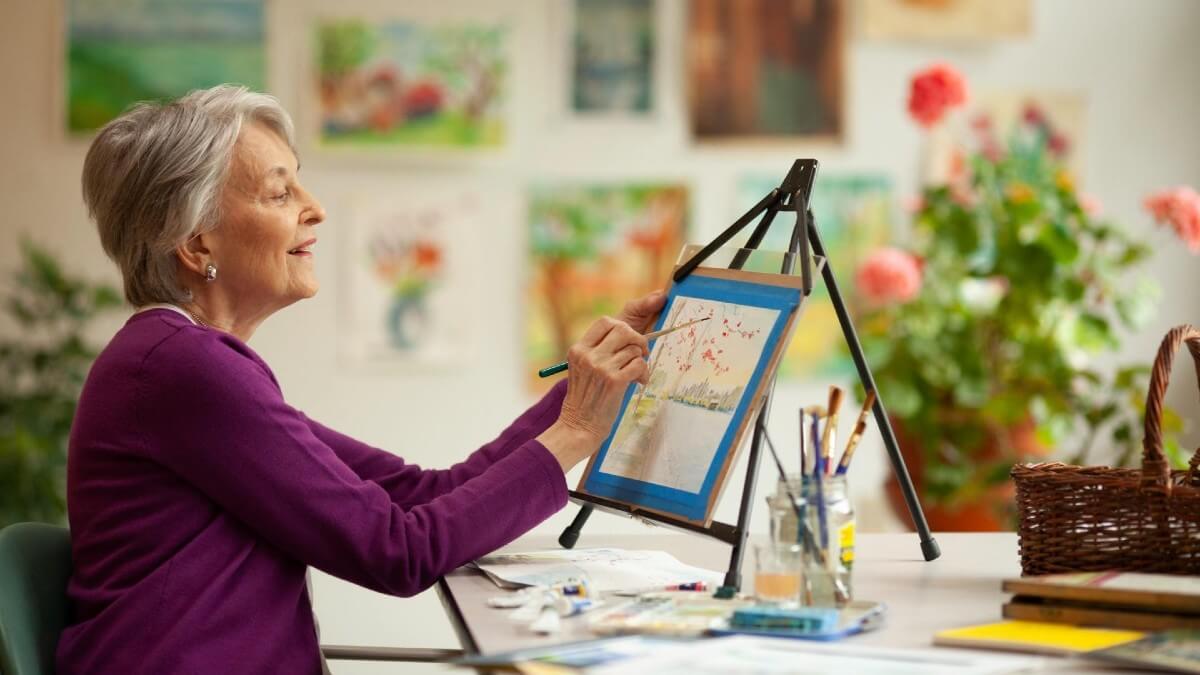 Older woman painting