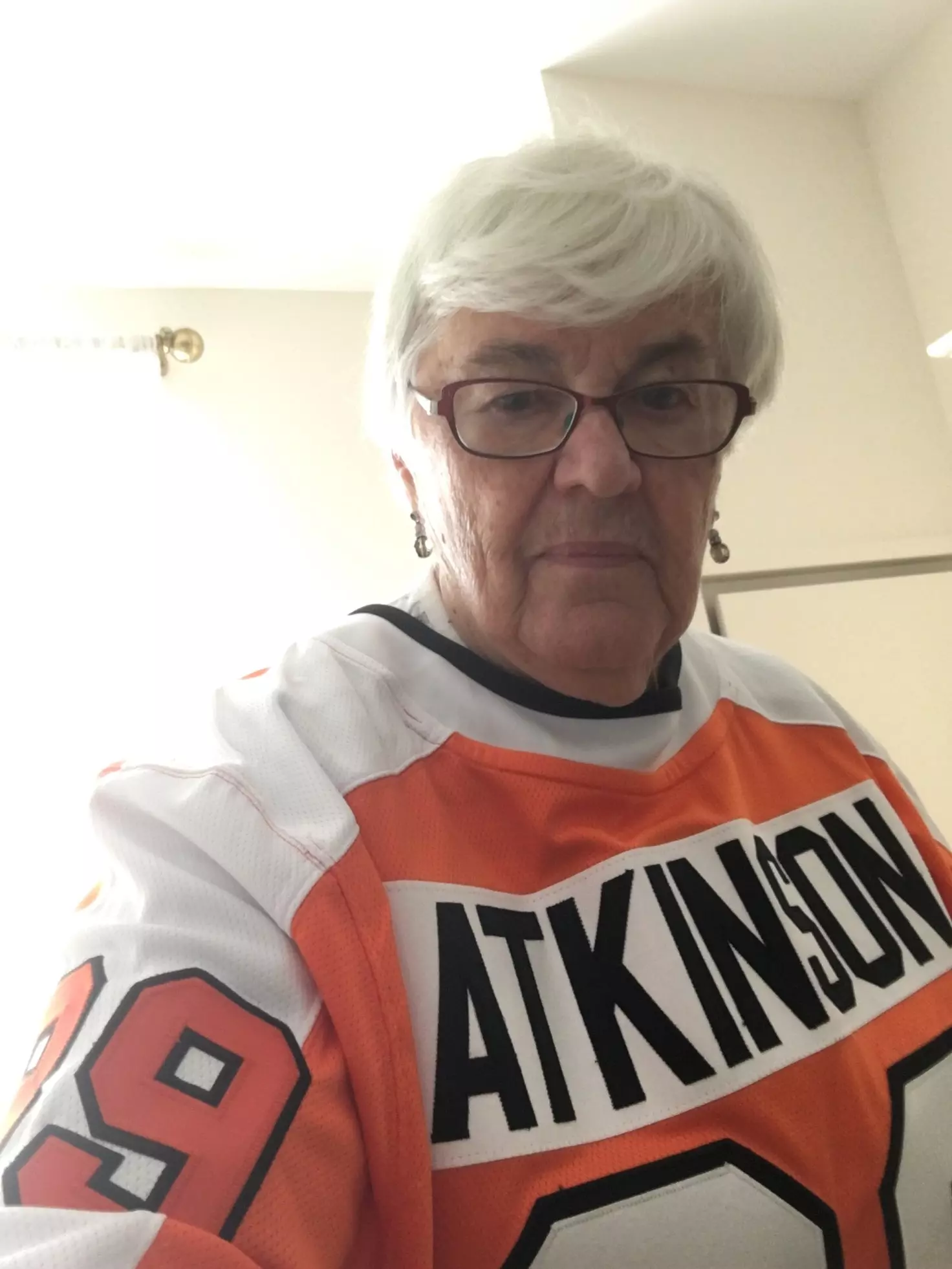 Older woman wearing Philadelphia Flyers jersey