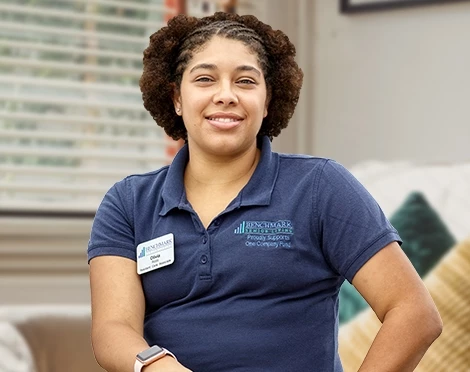 Benchmark-Web-Graphics_470x372_11.jpg Female associate at senior living home
