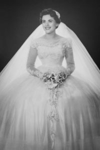 Black and white photo of woman in wedding dress