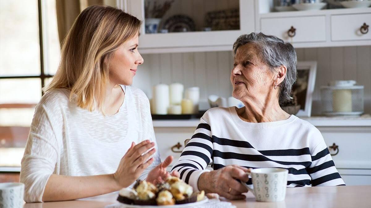 Woman and older woman speaking