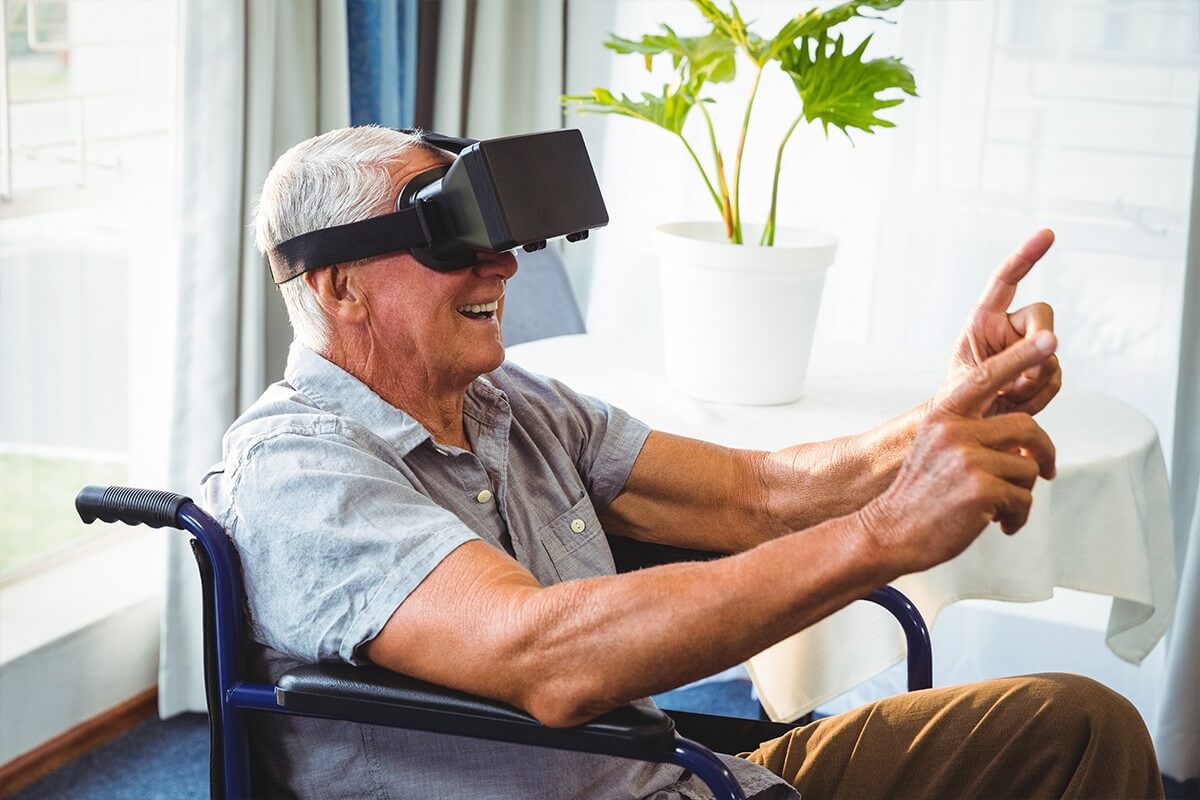 Senior man using VR headset