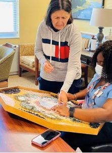 Associates at senior home working on art