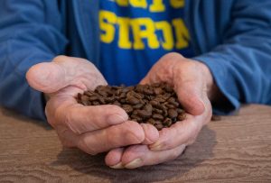 Man holding coffee beans