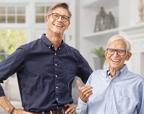 Benchmark-Web-Graphics_470x372-Father&SonSmiling_ghostedbackground.jpg Father and son laughing