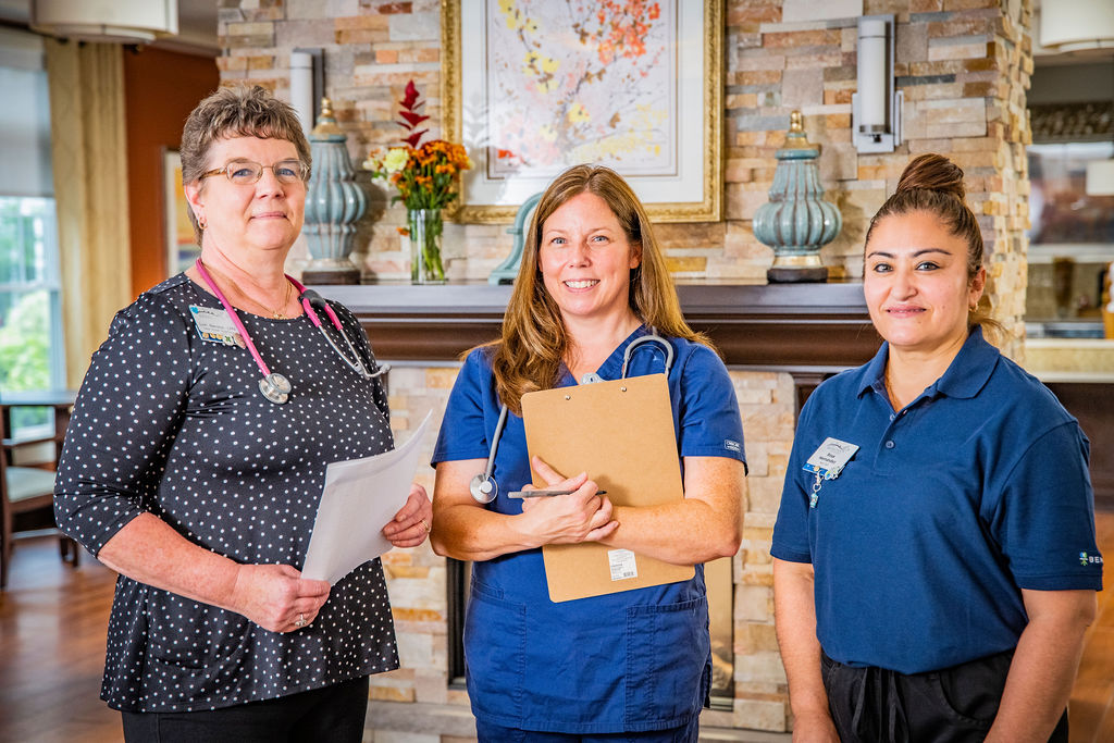 three benchmark associates smiling