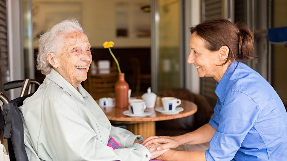 Two people holding hands and smiling