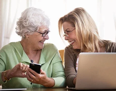 Woman and older woman laughing