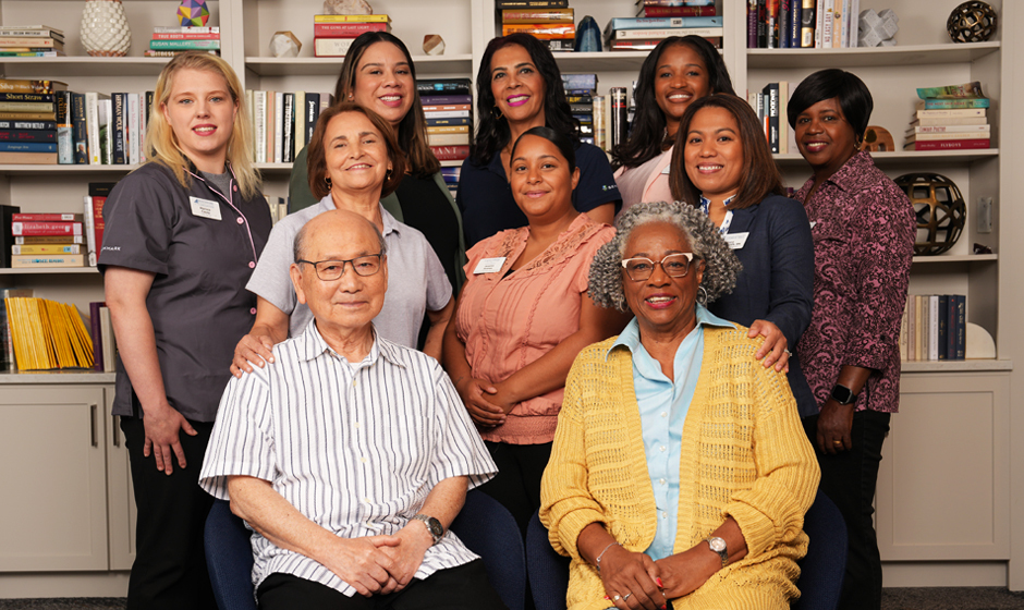 A group of people posed for a photo and smiling.