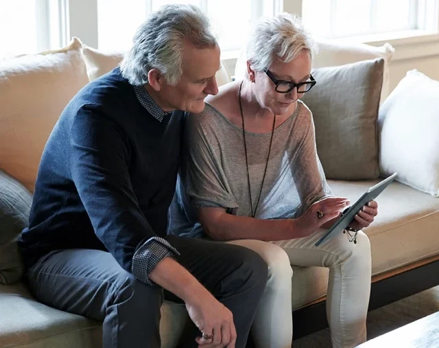 Older couple using tablet