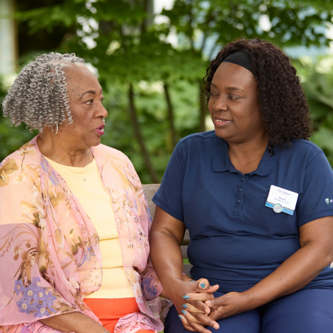 Associate talking with resident