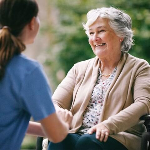 Respite Care Slider Nurse and woman holding hands
