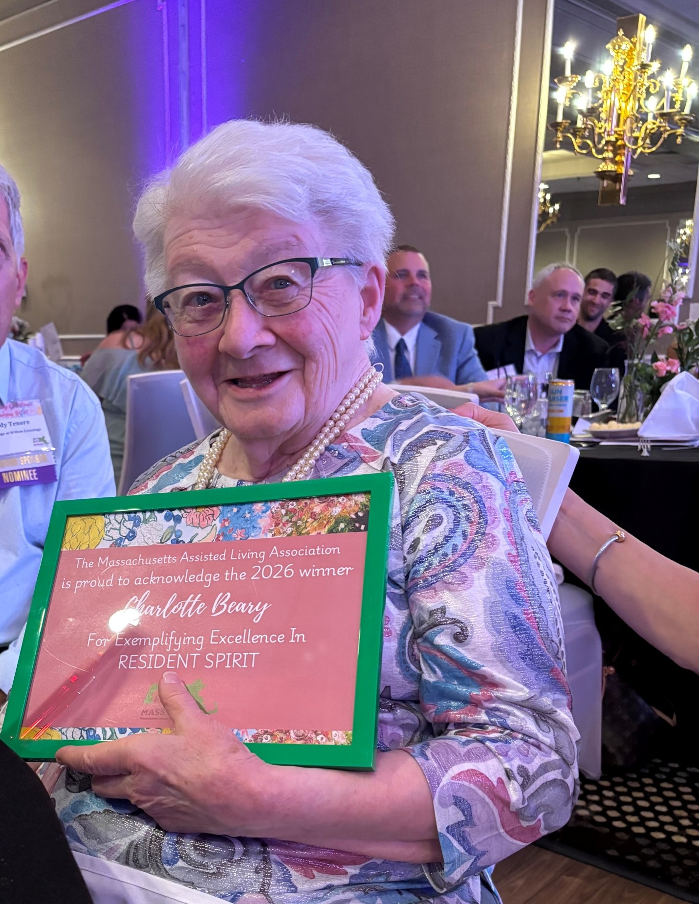 Charlotte Beary holding her Mass-ALA Resident Spirit Award